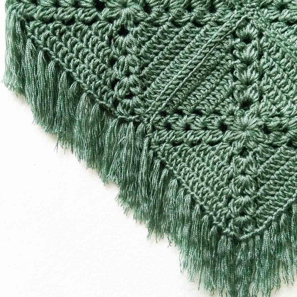 Pine cross summer top free crochet pattern close-up on fringe detail