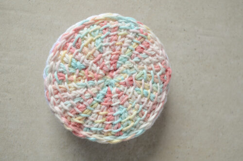 Front view of a Tunisian crochet face scrubby