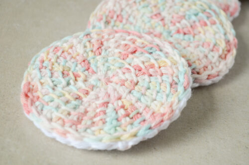 Tunisian crochet face scrubbies on top of one another